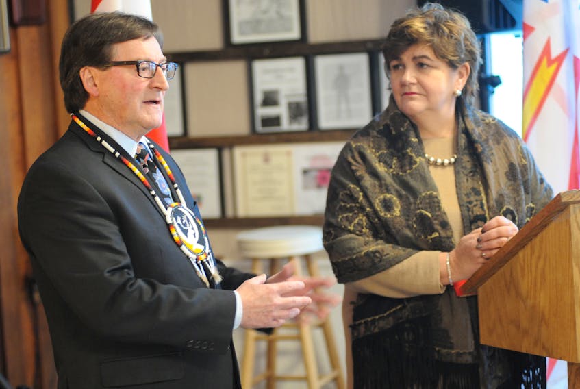 Qalipu Mi'kmaq First Nation Band Chief Brendan Mitchell (left) and Gudie Hutchings, the Liberal MP for Long Range Mountains, discuss the next steps in the band's enrolment process during a press conference in Corner Brook Thursday.