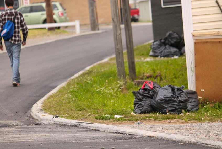 Some people on Princess Avenue in Stephenville weren't complying with the new Sort-It Western program on Tuesday and had their garbage and recyclables out in the dark garbage bags which have been banned.