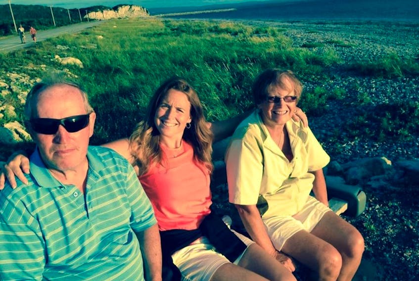 Dennis and Mary Byrne of Stephenville, the husband and wife involved in an accident on Trans-Canada Highway near Pinchgut Lake in December, are seen here with their daughter Trina Byrne on a bench at Stephenville beach. Mary died in the accident and Trina has been with her dad who is still on the mend in St. John’s.