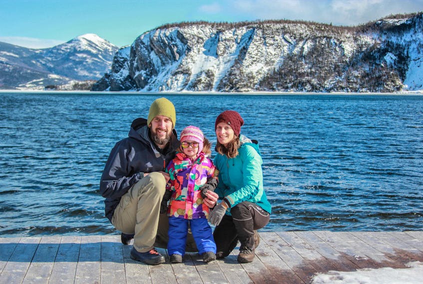 Kristen Hickey, seen here with her husband Robbie and two-year-old daughter Claire, poses for a photo on the dock of Gros Morne Adventures, the business she has purchased in Norris Point.