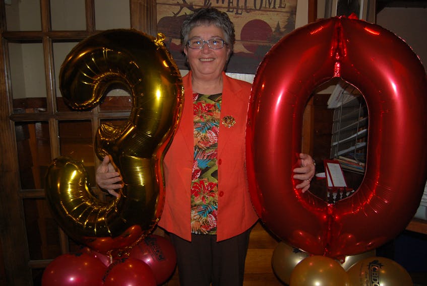 Debbie Wilton, a former client of the CBDC Long Range who is now a member of the board, poses for a photo as she helped the organization celebrate its 30th anniversary on Wednesday.