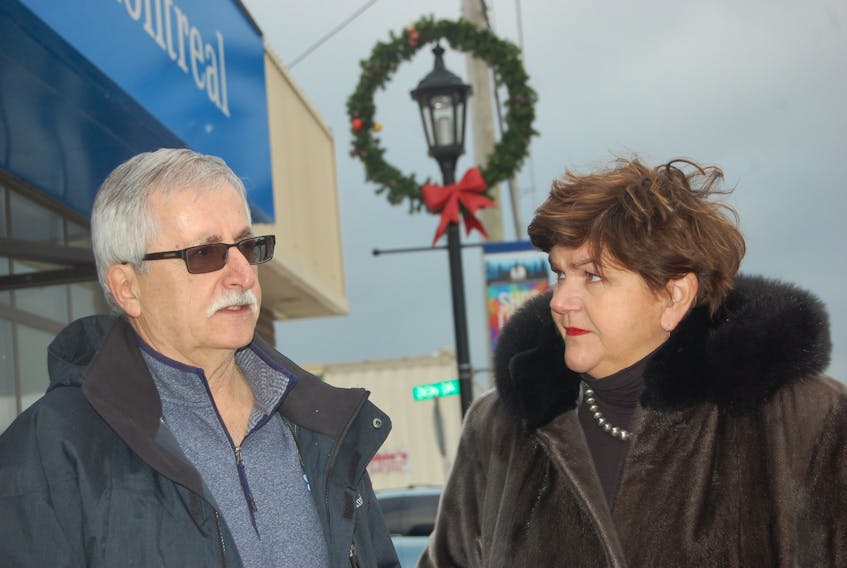 Bob Byrnes, project chair for the development of downtown Stephenville, and MP Gudie Hutchings pose on Main Street in Stephenville after the announcement on Monday of money to help with the development plan.