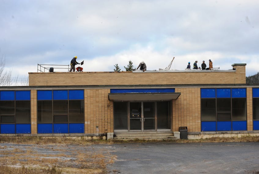 A crew of about a dozen people was busy working Thursday on the roof of the building purchased by the NL West SPCA with the hope of turning it into its new animal shelter, but which has now been sold by the organization.