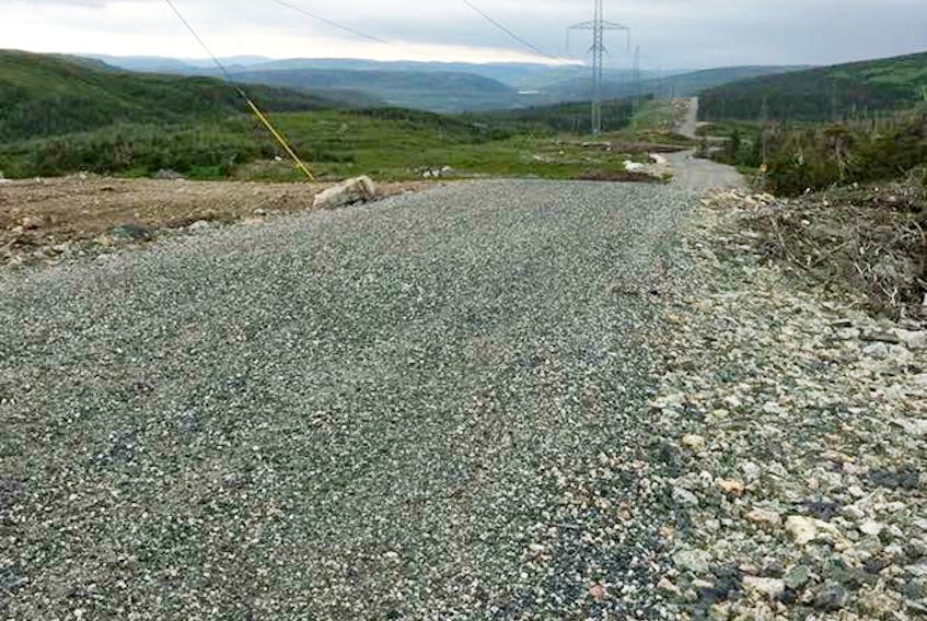 Crushed stone tops the new road that courses along the new transmission line on the Northern Peninsula as it stretches off into the distance.