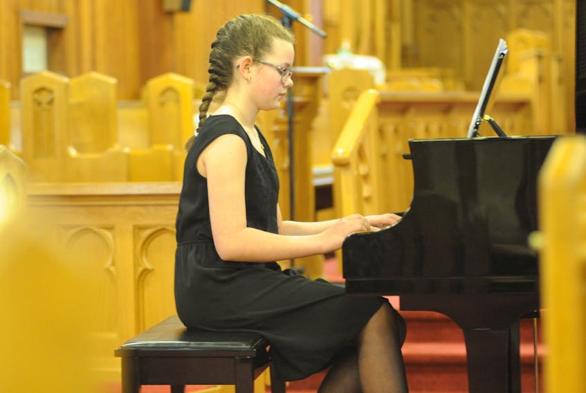 Alyssa Wentzell plays “Atacama Desert” by composer Wynn-Anne Rossi for her performance in the Piano Level 2 (not over 12 years old) Romantic, Modern and Inventions category at St. John the Evangelist Church during the Rotary Music Festival in Corner Brook Wednesday afternoon. The festival continues at multiple venues until the final concert and awards Tuesday.