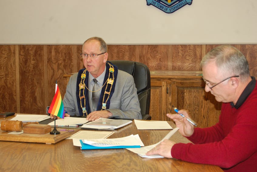 Mayor Tom Rose is seen speaking on openness and transparency, while Coun. Mark Felix, the town’s finance committee chair, is seen on the right.