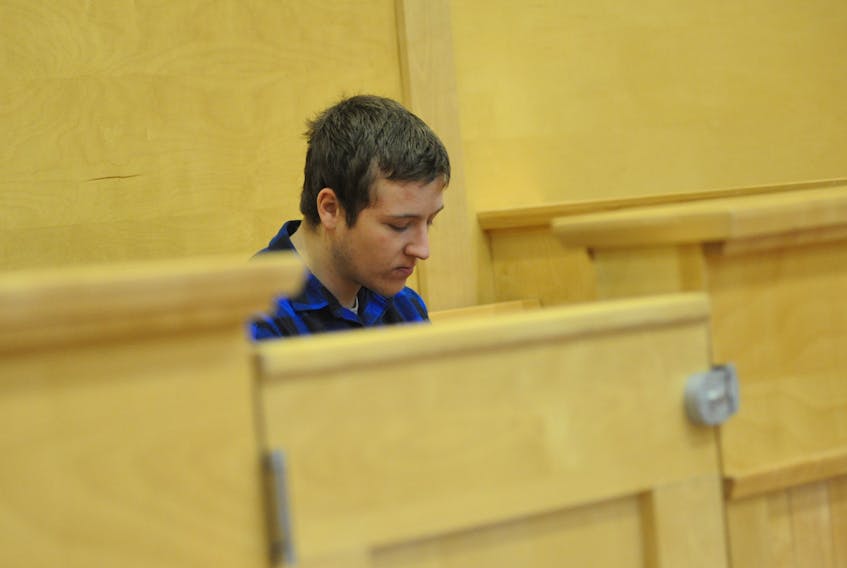 Riley Byrne, 18, awaits his appearance in provincial court in Corner Brook Wednesday afternoon