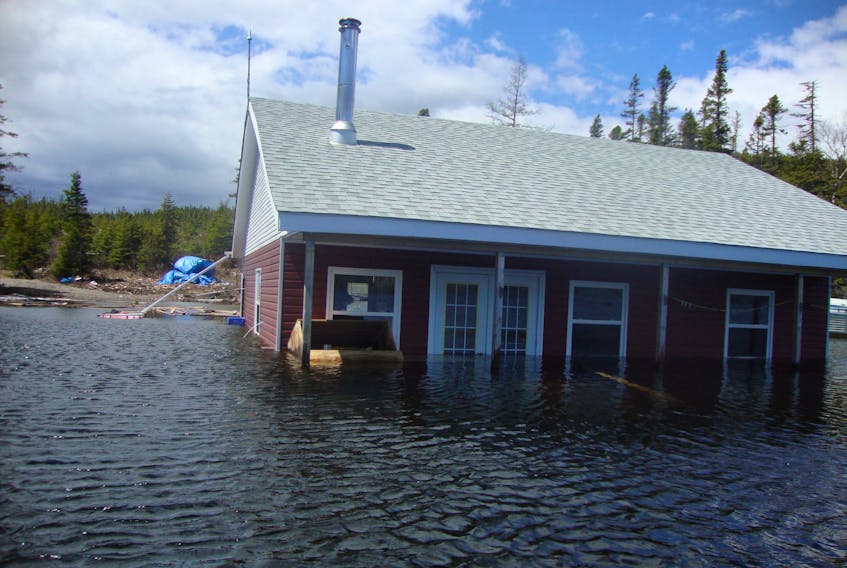This cabin at Bottomless Pond belonging to Mark Hoyles of Deer Lake is still half-submerged in floodwaters.
