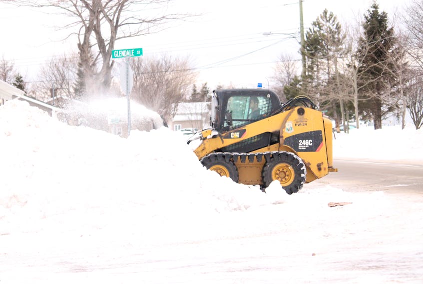 The Town of Stephenville’s skid steer with snow blower attachment has been kept busy gnawing into the snow so far this winter doing sidewalks and this week clearing around intersections like this one at Glendale Street with St. Clare Avenue. It was still cleaning up from a heavy dumping of snow in the town the previous week.