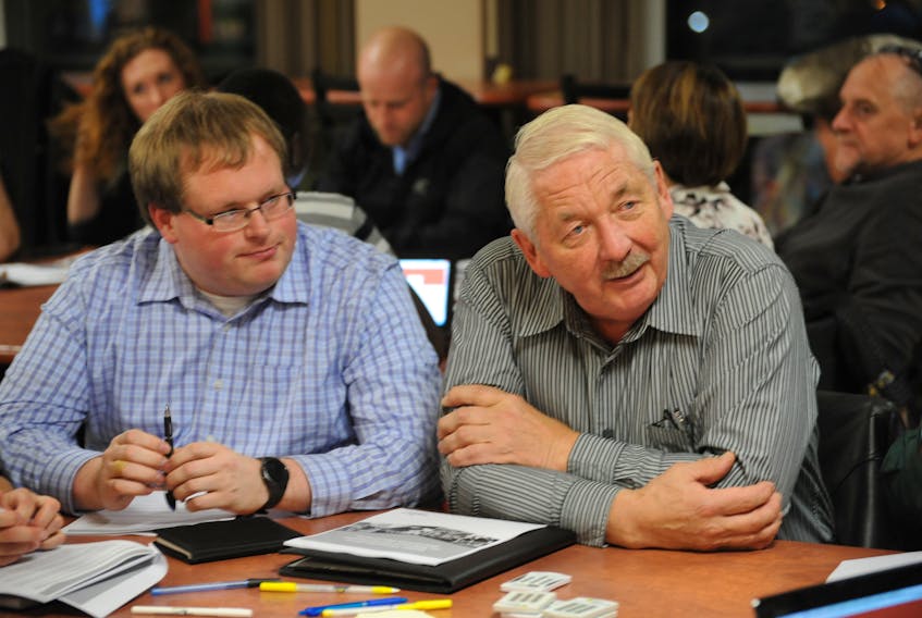 Pasadena town council members, from left, Deputy Mayor Terry Randell and Coun. Derrick Anthony, discuss regional governance at the public consultation session held in Corner Brook Wednesday.
