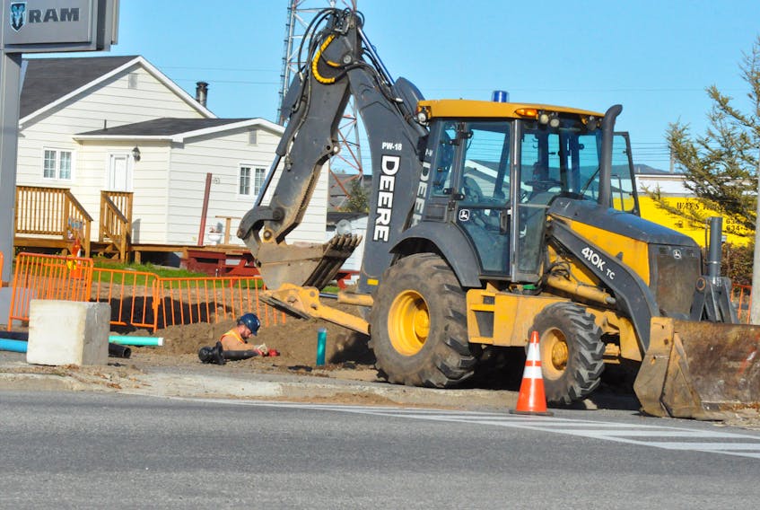 Here the workers are seen installing the waterline near where the property abuts Prince Rupert Drive.