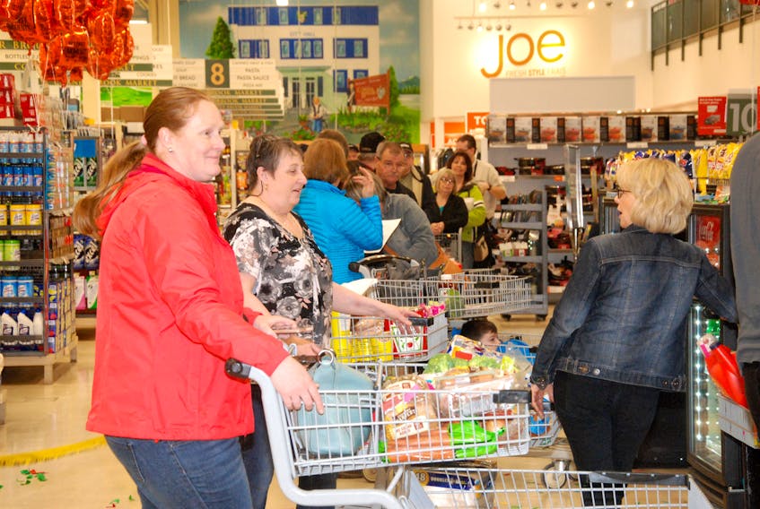 Several dozen customers were pretty happy at the Dominion Store in Corner Brook Wednesday morning. Customers got a big surprise when they got up to the counter and discovered their groceries were free of charge. Some people went home with hundreds of dollars worth of food, while others only had a few items - all compliments of the store.