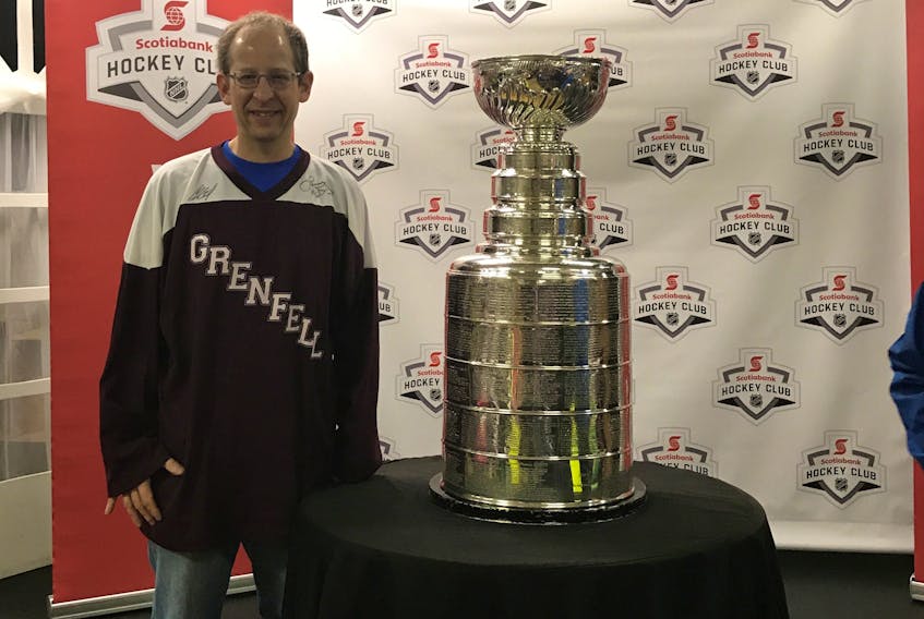 Jeff Keshen, vice-president, Grenfell Campus, poses with the Stanley Cup.