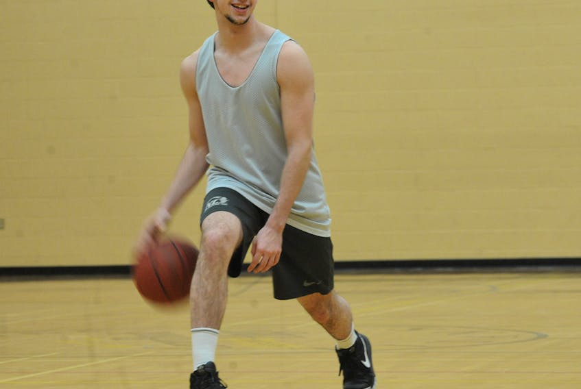 Thomas Stewart of the Corner Brook Titans warms up for practice with the high school’s senior boys’ basketball team in advance of this weekend’s Hall of Fame Cup tournament in St. John’s, which features the top eight senior high school basketball teams in Newfoundland and Labrador.