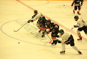 Several prospects for the Western Knights minor midget hockey team for the three-team provincial league participate in a skating drill during open tryouts for the team this past weekend at the Corner Brook Civic Centre.