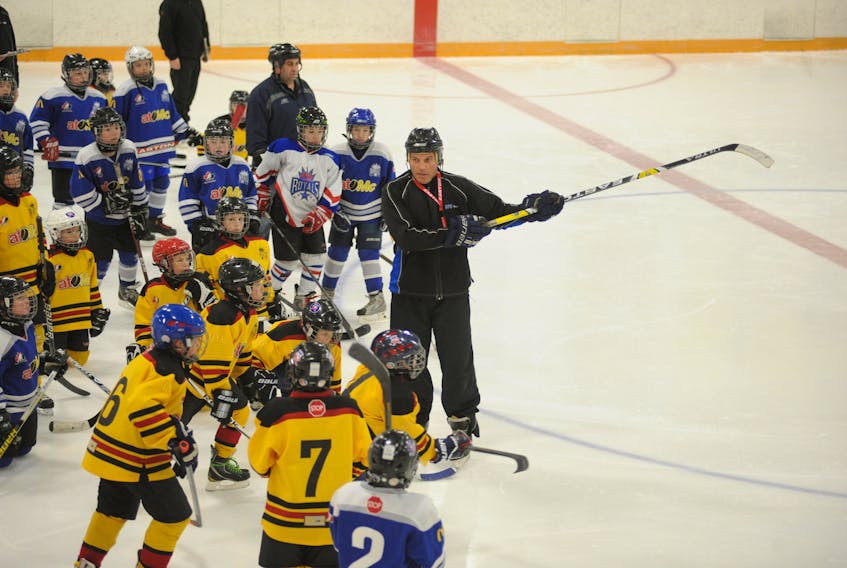 Rob French conducts a practice for young minor hockey players in the Corner Brook minor hockey program in this Star file photo. French is giving the thumbs up to Hockey Canada’s decision to implement a new policy that mandates cross-ice and half-ice hockey for initiation-aged players that’s in place for the 2017-2018 season.