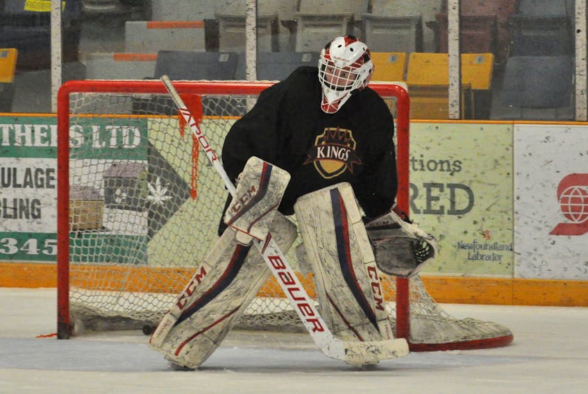 Western Kings goalie Lucas Wiseman keeps his eyes on the action in front of the net during a drill at team practice on Wednesday night at the Corner Brook Civic Centre.