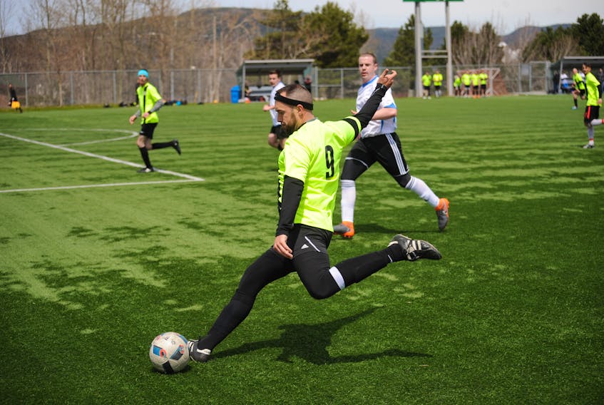 Chris Bulger of the West Side Monarchs kicks the ball towards the middle of the field in the opposition's end during his squad's match against Gander in the Corner Brook Men's Soccer League 2018 Kick-Off Cup tournament at the Wellington Street Complex Saturday.