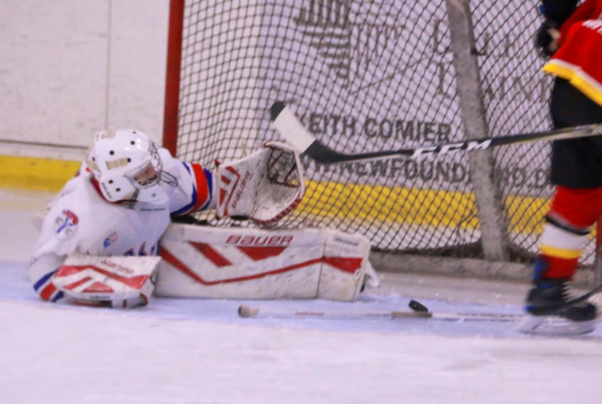 Elwood High Lakers goaltender Logan Burden managed to keep a puck that deflected off the post out of his net during high school hockey league play versus the St. James Regional High Saints on Monday evening at the Hodder Memorial Recreation Complex.