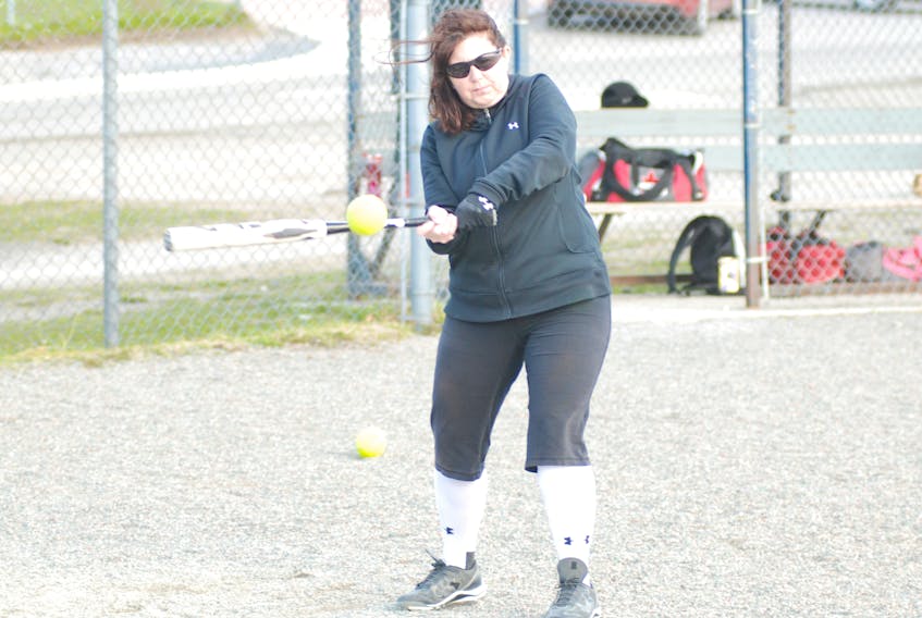 In advance of the 2018 season, the Corner Brook Women’s Softball League team Whelan’s Gate held practice Monday night at the Ambrose O’Reilly Memorial Field. Here, Kathy Lukeman is shown as she drove a few balls to her infielders.
