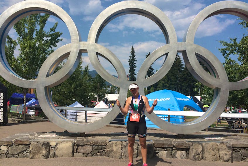 Corner Brook native Lisa LeDrew poses for a photo outside the Whistler Olympic village moments after she crossed the finish line at the Ironman Canada 70.3 on Sunday.