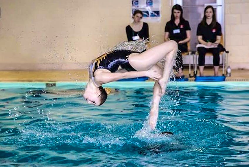 Claire Beck of the Corner Brook Synchronized Swim Club performs her junior team routine at the 2017 provincial synchronized swim championships.
