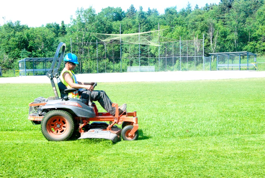 Don Wareham of the City of Corner Brook’s lawn maintenance crew was busy cutting the grass at the Monarchs Complex softball diamond Wednesday afternoon. The venue is being used for the Memorial Sweet Pee Softball Tournament this weekend.