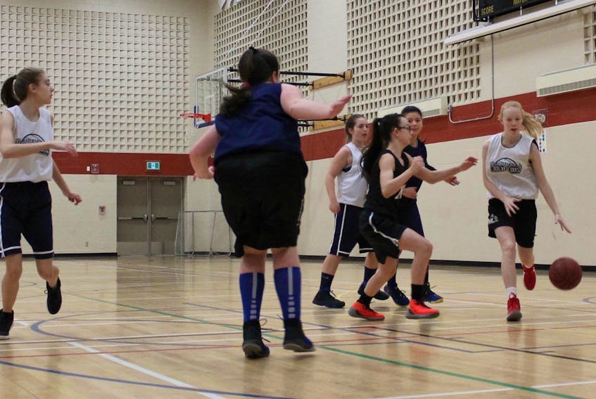 Laura Taylor dribbles her way toward the basket during a recent practice for the Humber Valley Mountaineers U14 girls basketball team. The Mountaineers will play host to the 2018 Newfoundland and Labrador Basketball Association U14 Boys and Girls Club Championships.