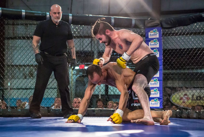 Photo by Martin Blais/Aggro Photography

Jake Kelly, son of Peter and Blossom Kelly, lands a punch to the head of Robbie Innes at Extreme Cage Combat 23 in Halifax in 2015. Kelly won his debut fight with a rear naked choke at 1:10 of the first round. He is now 2-0 and will fight for the Elite 1 MMA amateur bantamweight title Nov. 4 against Corey Forsythe in New Brunswick.