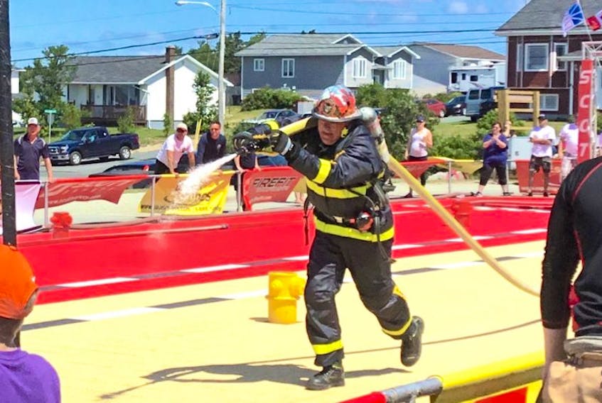 In this file photo, Craig Harnum is seen shooting a hose line at a target during the tandem event in the Over-50 age bracket at the 2017 Scott Firefit Newfoundland Championships in the Over-50 bracket.