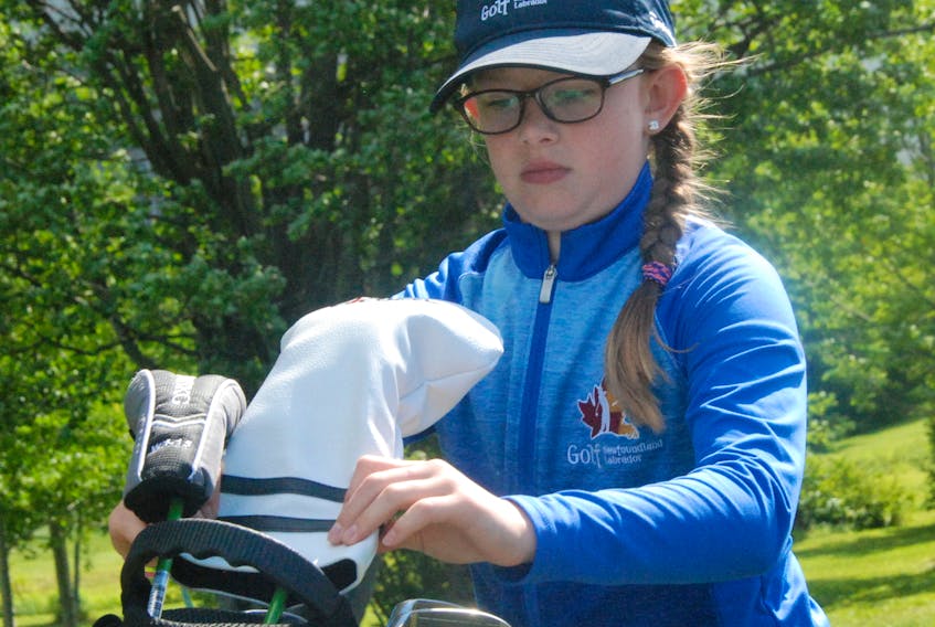 Corner Brook's Paige Allen puts her clubs back in her golf bag after finishing up on the first hole of the 2018 Tely Junior Golf Tour's Blomidon Junior Invitational Wednesday morning at Blomidon Golf and Country Club.