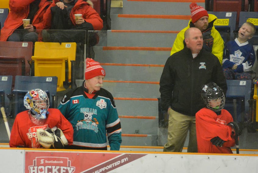 NHL legend Lanny McDonald wears a Orillia Terrier jersey while coaching the Terriers during the Heroes of Hockey Day game in Corner Brook Saturday.