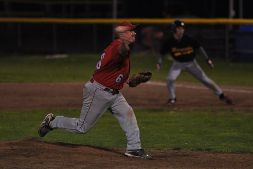 Veitch Wellness Aces' Brian Bennett delivers a pitch during Game 2 of the city senior baseball final against the West Side Monarchs Tuesday night at Jubilee Field.