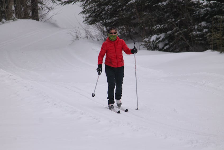 With a scarf wrapped around her face to shield from high winds, Marina Delaney was enjoying the Whaleback Nordic Ski Club trails on Tuesday afternoon when she went for a run. She said the trails are in excellent shape.