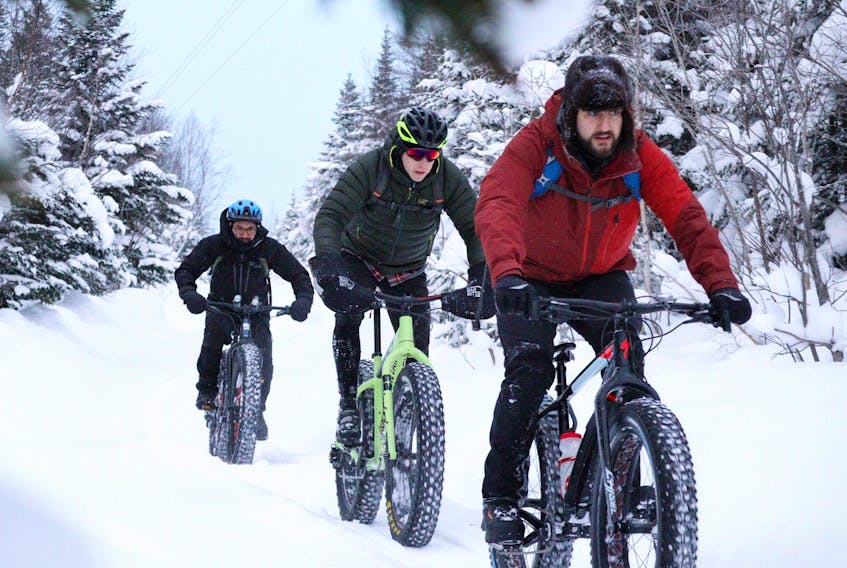 Dave LaRose, leading the pack, and Xavier Campos, left and Billy Newell are seen here enjoying a ride on fatbikes on a snowmobile trail near Corner Brook during the Christmas holidays. LaRose is excited about being provided an opportunity to ride his fat bike on the groomed trail system at Blow Me Down Trails in Corner Brook.