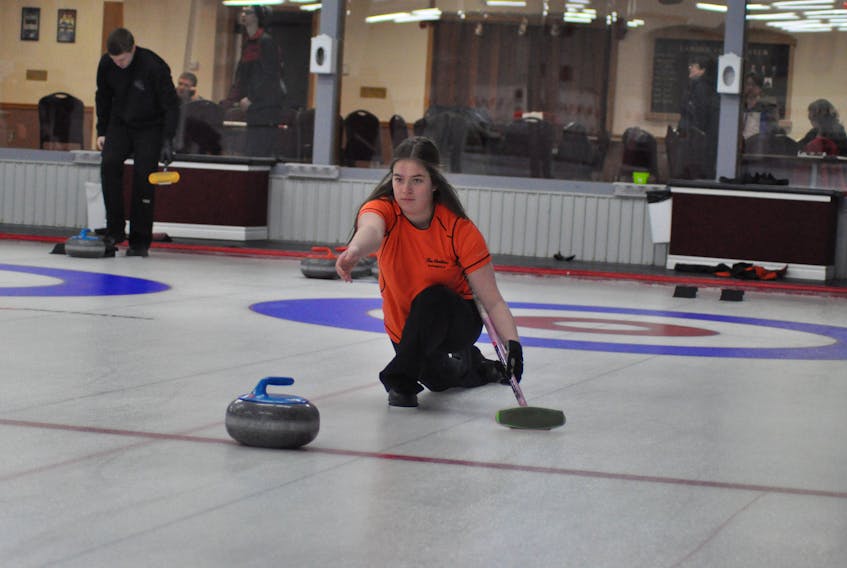 Sarah Cassell, third for Sarah McNeil-Lamswood’s U18 female curling foursome, gets in some practice Thursday at the Caribou Curling Club. Stephenville will host to the provincial 16U and 18U male and female curling championships Feb. 14-18 at the Caribou Curling Club.