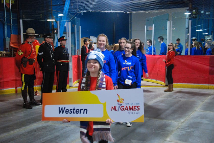 Led by Aliyah Alexander, holding the team sign, Team Western athletes are introduced at the opening ceremony for the 2018 Newfoundland and Labrador Winter Games Saturday night at the Hodder Memorial Recreation Complex in Deer Lake.