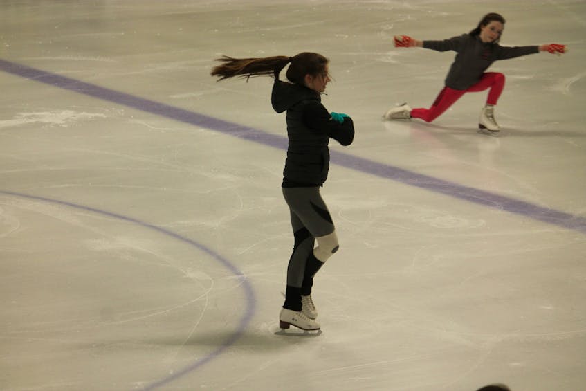 Claire McIntosh, foreground; and Rachel McIntosh of the Stephenville Skating Club get in some figure skating practice on the ice at Stephenville Dome recently.