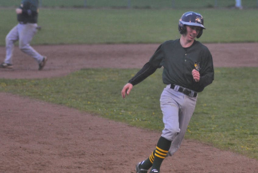 Veitch's Ultramar Hawks' Cole Porter rounds third base to eventually score as teammate Darren Colbourne is shown reaching second in the background during a six-run second inning for the Corner Brook Molson Senior Baseball League team in a game against the Wing'n It Marlins.