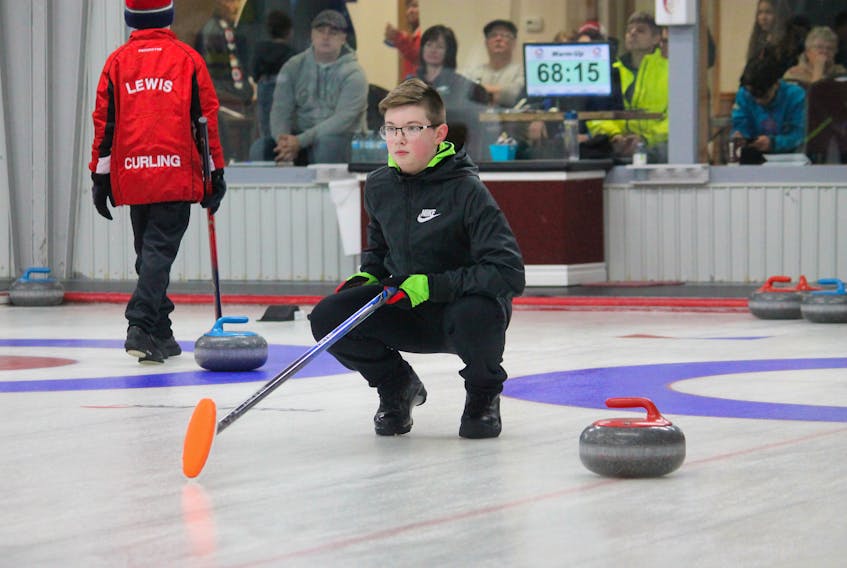 Will Butler of the Caribou Curling Club lines up a shot during a round-robin game against Thade Flood of Bally Haly of St. John’s in the 16U male division at the provincial U18 and U16 male and female curling championships being held this week at the Caribou Curling Club. Butler won this game by an 11-2 score.