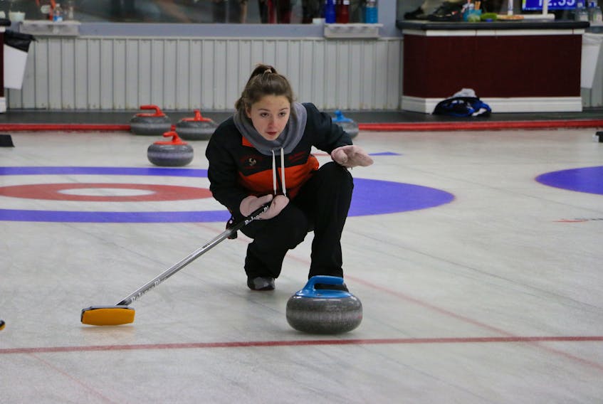 Skip Sarah McNeil Lamswood of the host club watches the line during action from the U18 women's division of the 2018 provincial U18 and U16 male and female provincial curling championships over the weekend at the Caribou Curling Club in Stephenville.