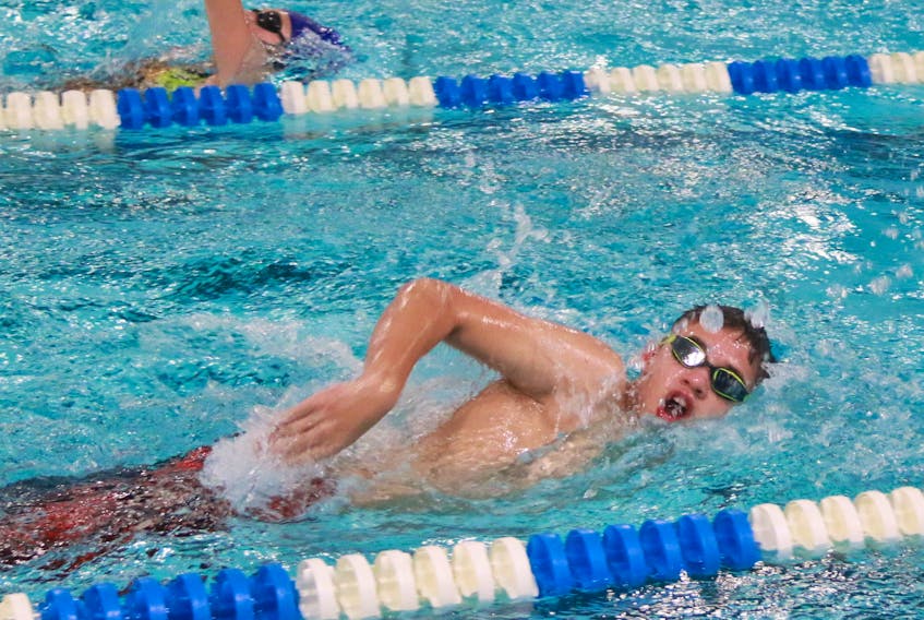 Dolphins competitive swimmer Tyson Curtis completes a series of laps using a variety of different swim strokes.