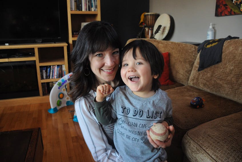 Three-year-old Obie Broadbent of Corner Brook, seen here with his mom Jennifer, will get to enjoy Challenger Baseball, a special program designed for children with disabilities, this summer. Gary Kean/The Western Star