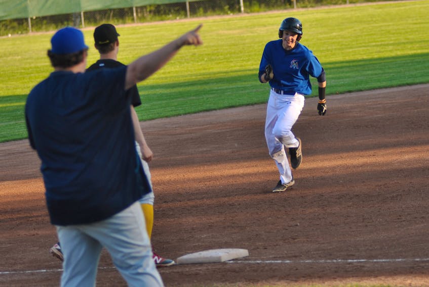 Wing'n It Curling Marlins' Kyle Brown dashes towards third base as he's directed home to score during a Corner Brook Molson Senior Baseball League game against the West Side Monarchs at Jubilee Field on Tuesday evening.