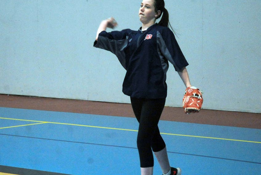 Twelve-year-old Abby Welshman tosses the ball to Lauren Pike, also 12, during an U14 girls session of the Corner Brook Minor Baseball Association’s winter program at the Corner Brook Civic Centre annex on Tuesday night.