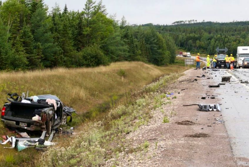 Three people were killed in a head-on collision involving two vehicles about half a kilometre west of the Howley Junction. Department of Transportation and Works personnel cleared the debris that had been scattered across the highway.