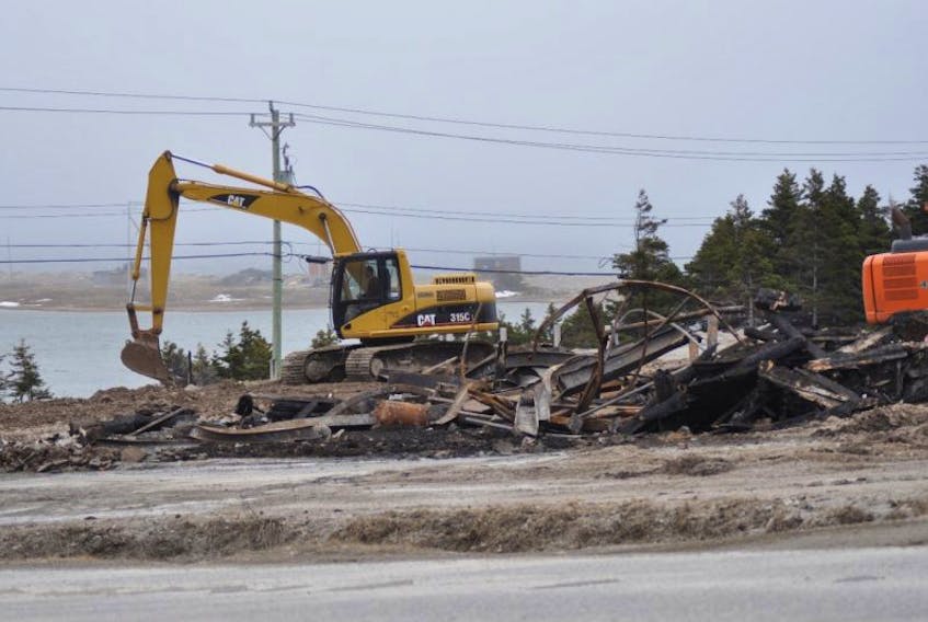 Equipment owned by Gabriel Construction of Felix Cove was involved in the cleanup of the Abbott & Haliburton Home Building Centre site in Port au Port West this past Friday in the wake of a fire that leveled the business in the early morning hours and into the day on April 3.