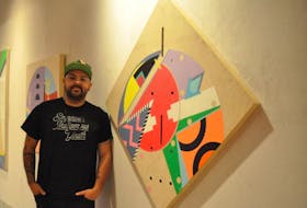 Mi’kmaq artist Jordan Bennett poses for a picture beside one of the pieces in his Wije’wi (Come With Me) exhibit, which opens at the Grenfell Campus Art Gallery in Corner Brook today.
