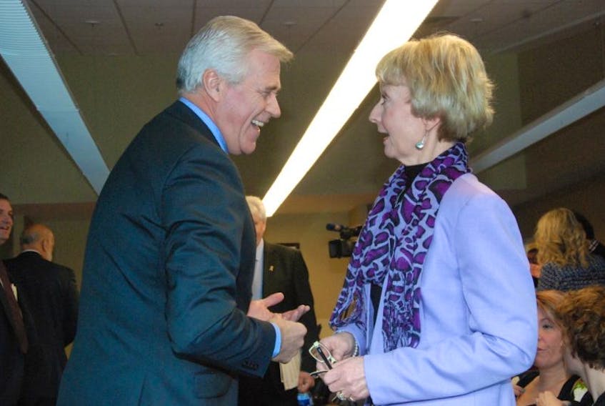 Premier Dwight Ball shares a laugh with Grenfell Campus vice-president Mary Bluechardt Friday morning before his news conference on the plan to begin construction of a new long-term care facility in Corner Brook in 2017.