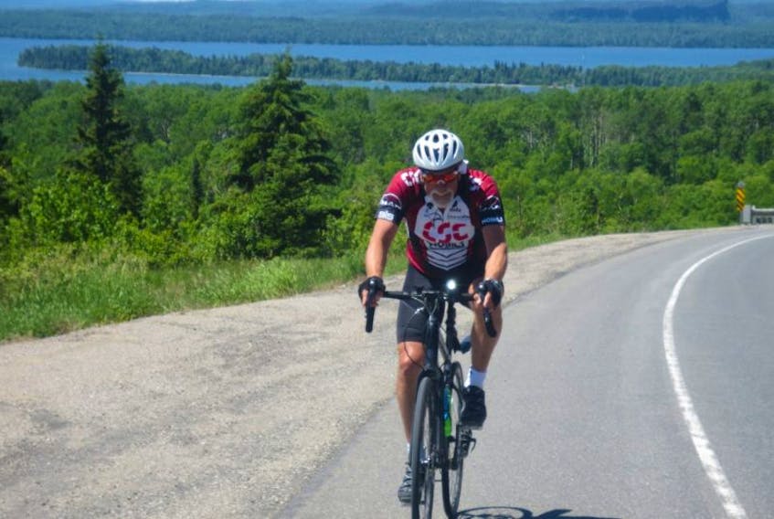 Dave Mackenzie, a New Brunswick native who now calls Cowichan Bay on Vancouver Island home now, is cycling across Canada to raise money for the fight against cancer through his Dave Pedals for Hope fundraising inititative. He is seen here riding along the north side of Lake Superior in Ontario earlier in his cross-country trek.